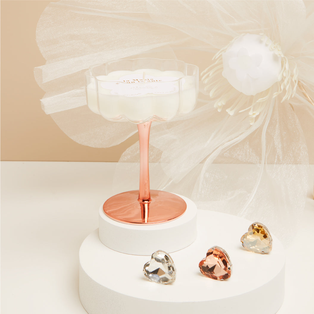 Candela in bicchiere oro rosa