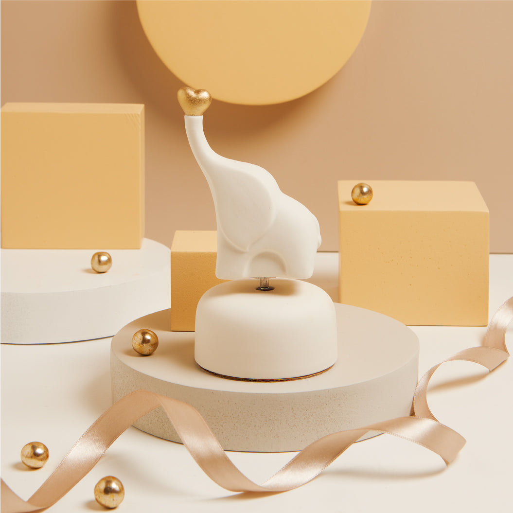 Carillon elefantino bianco con cuore oro