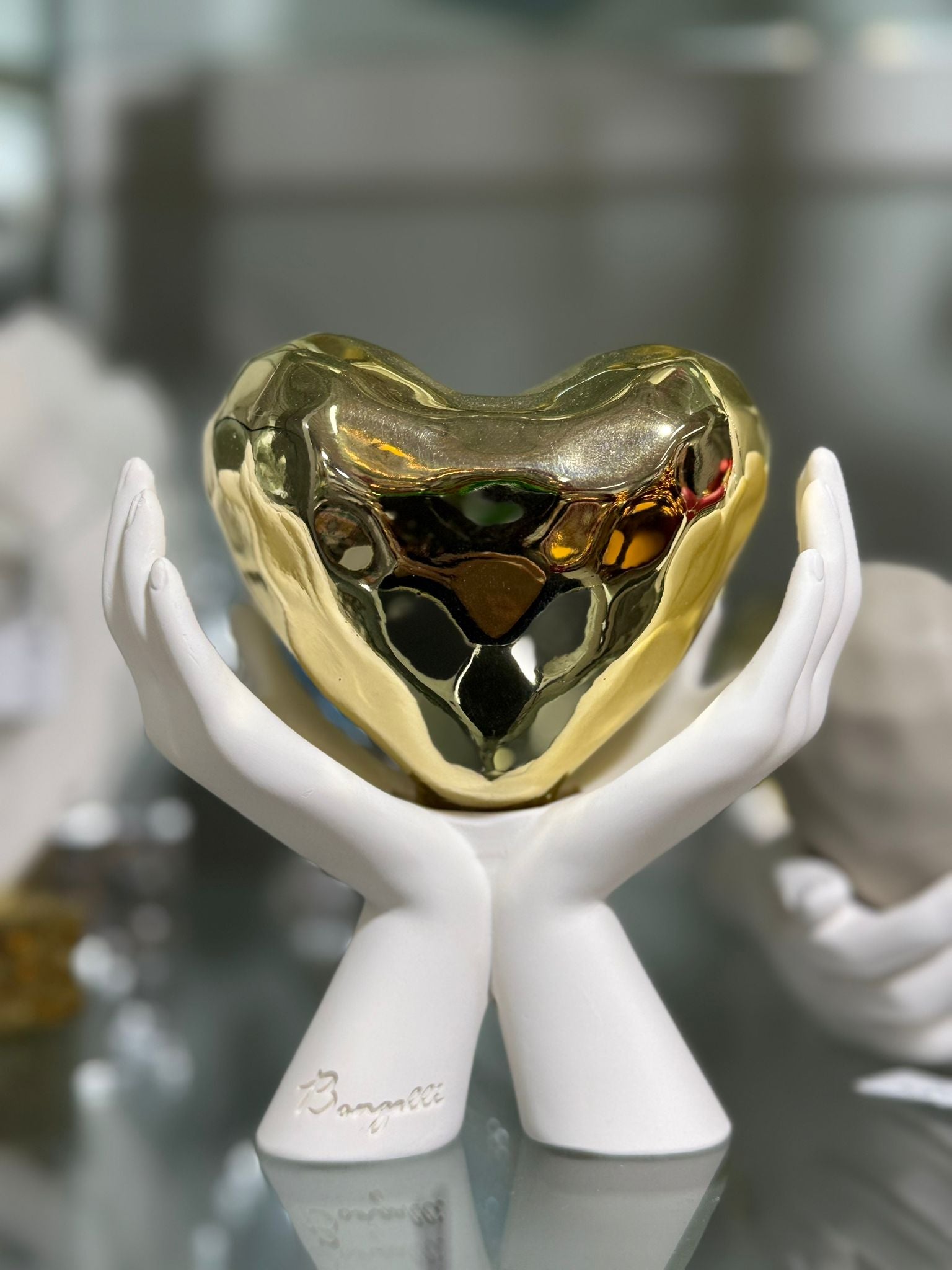 Cuore mani oro e bianco