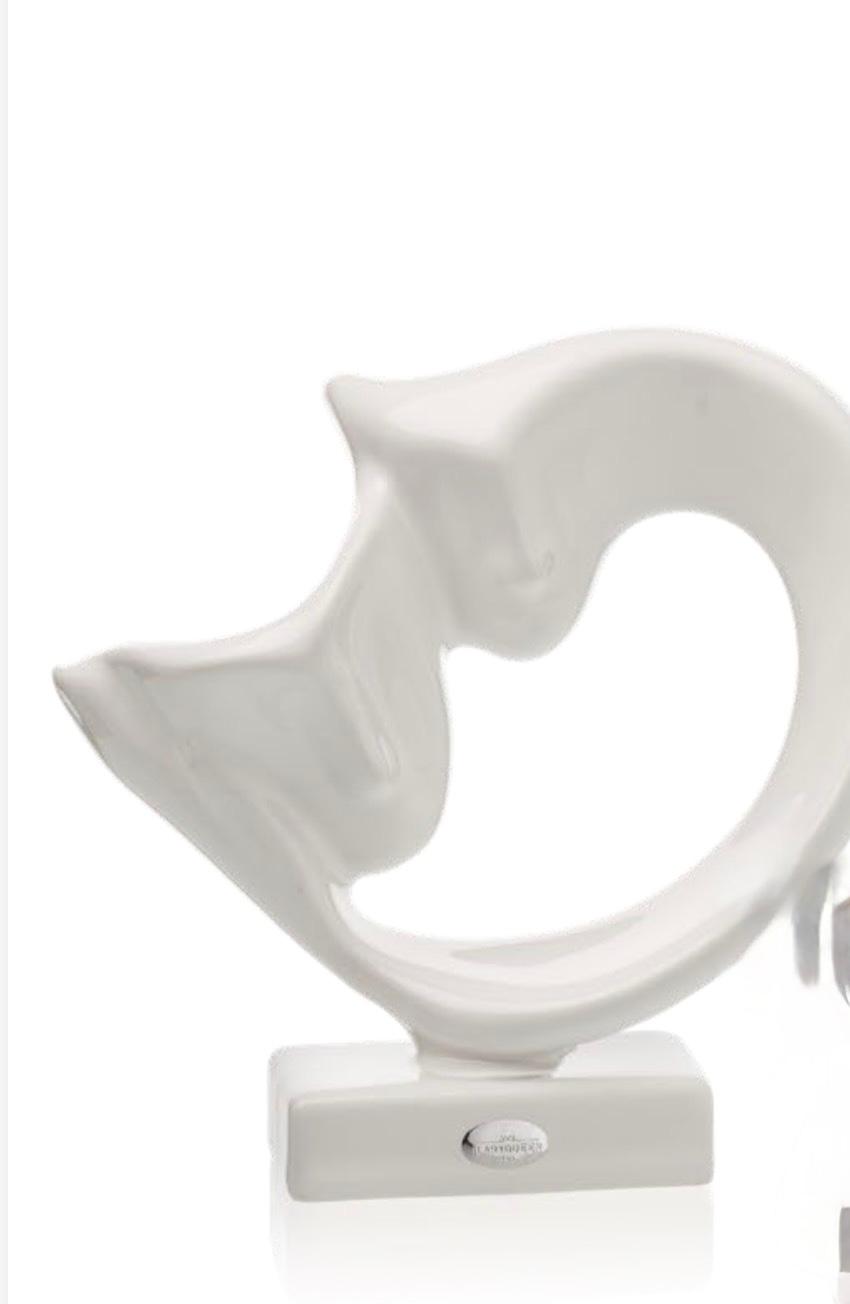 Scultura "Abbraccio" lucida